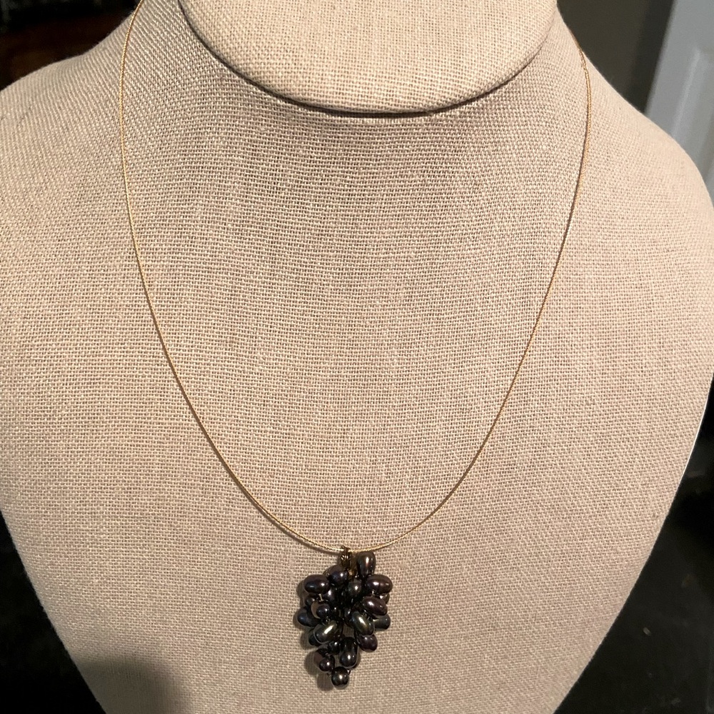 Fresh water Pearl cluster forming a (grape cluster) on a fine cable.
